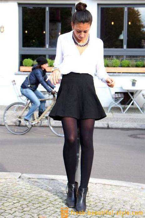 Falda negro está de vuelta en boga. falda estilo. A partir de qué ponerse?